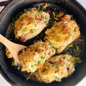 Spinach-Artichoke-stuffed-Chicken-in-cast-iron-skillet