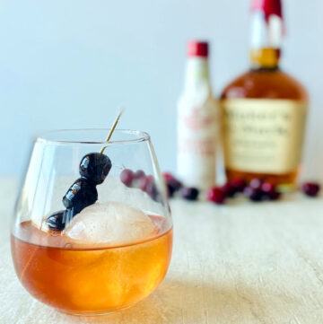 cherry-manhattan-in-glass-with-cherry-garnish-and-round-shape-ice