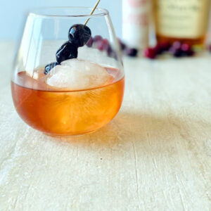 cherry-manhattan-in-glass-with-cherry-garnish-and-round-shape-ice