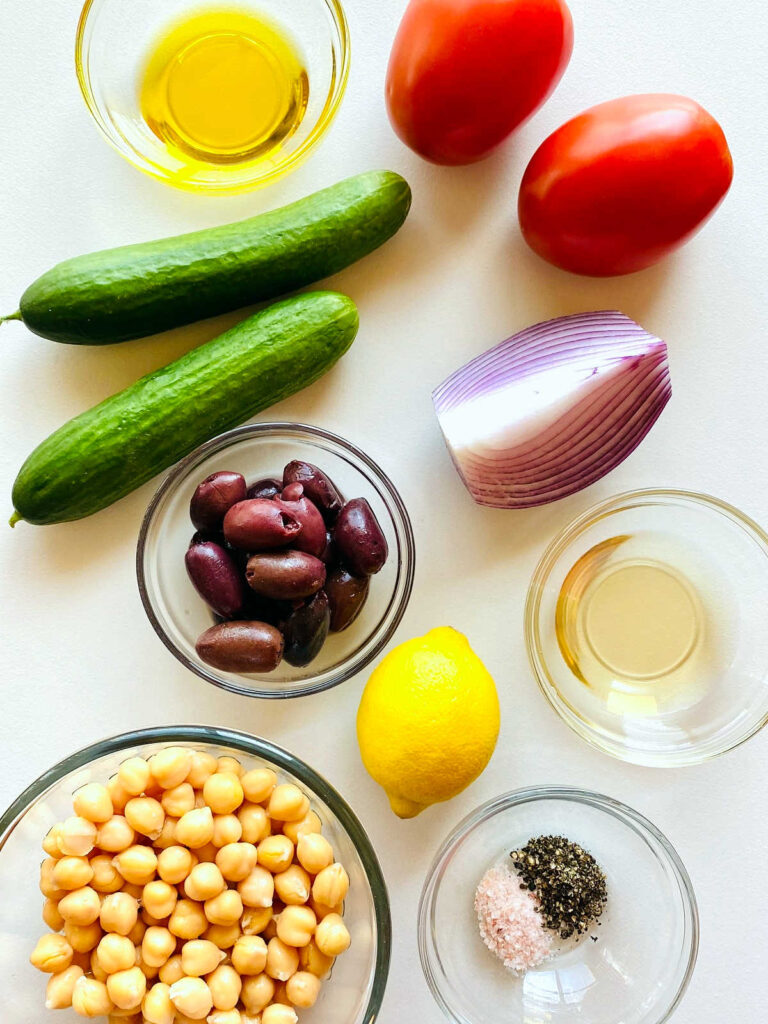 labeled photo of individual ingredients to make mediterranean chickpea salad