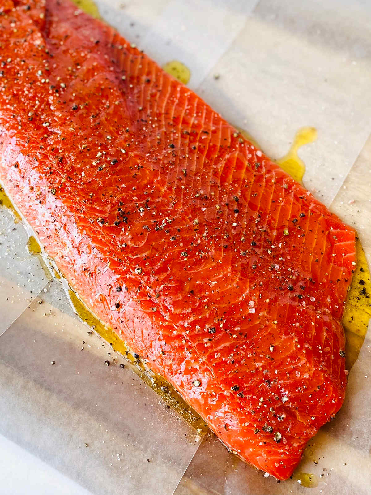 wild caught sockeye salmon covered with olive oil salt and pepper