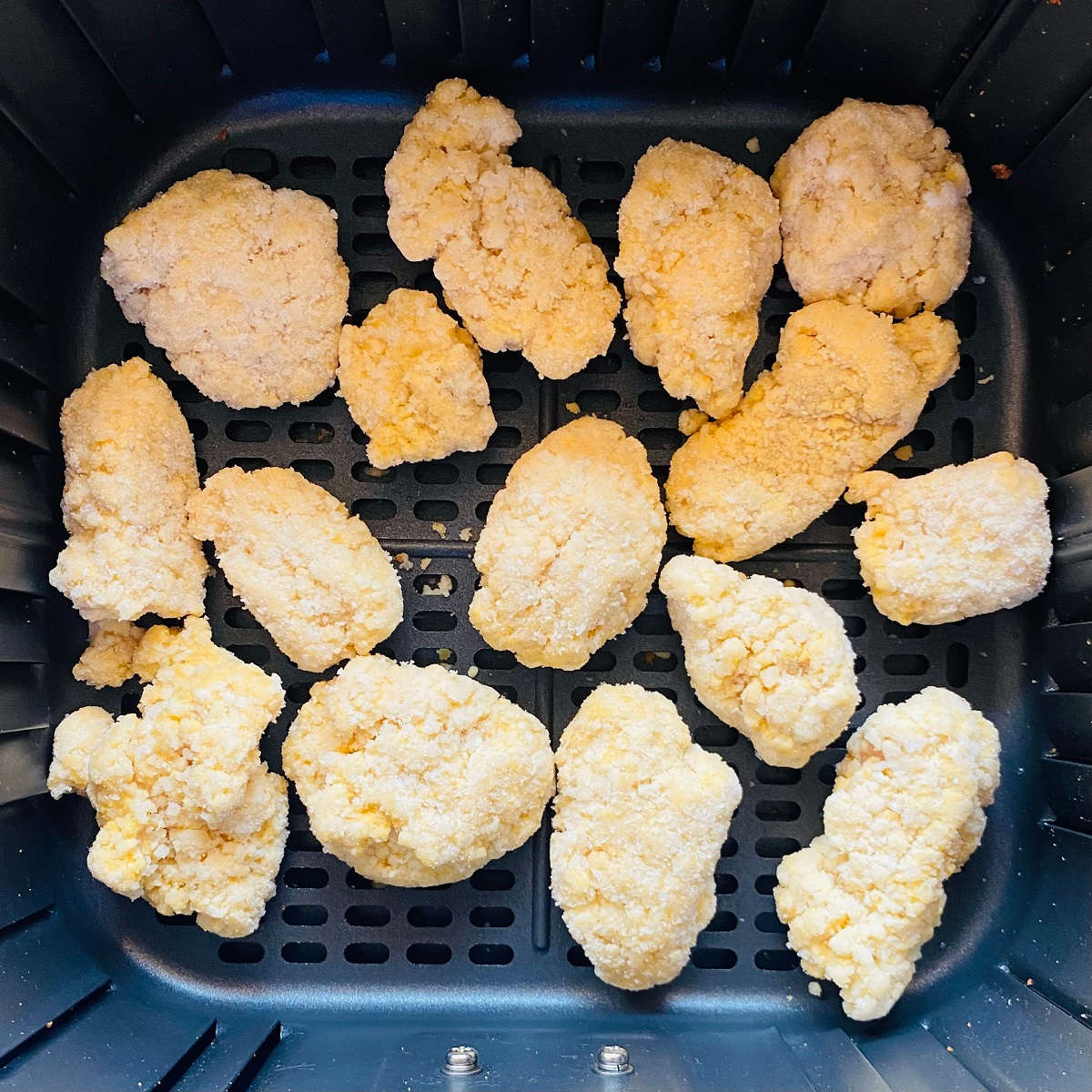 air fryer frozen chicken nuggets in fryer basket