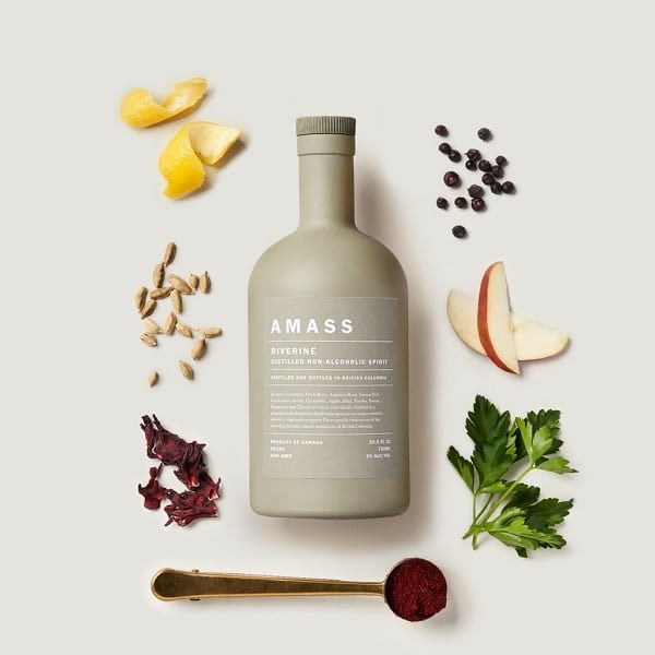 amass vodka surrounded by different botanicals