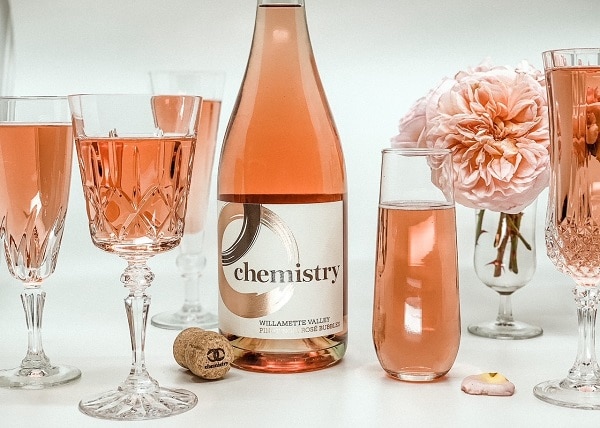 chemistry wine surrounded by glasses of wine and flowers