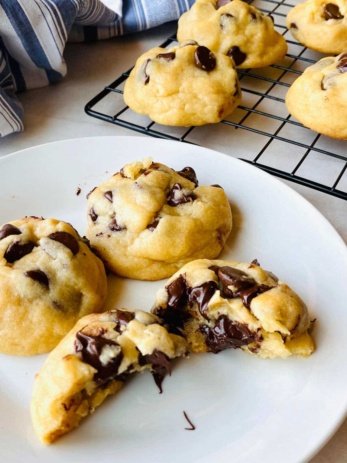 chocolate chip cookies without brown sugar broken in half with chocolate oozing out