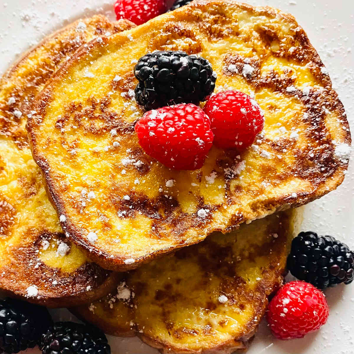 best sourdough french toast on plate with berries