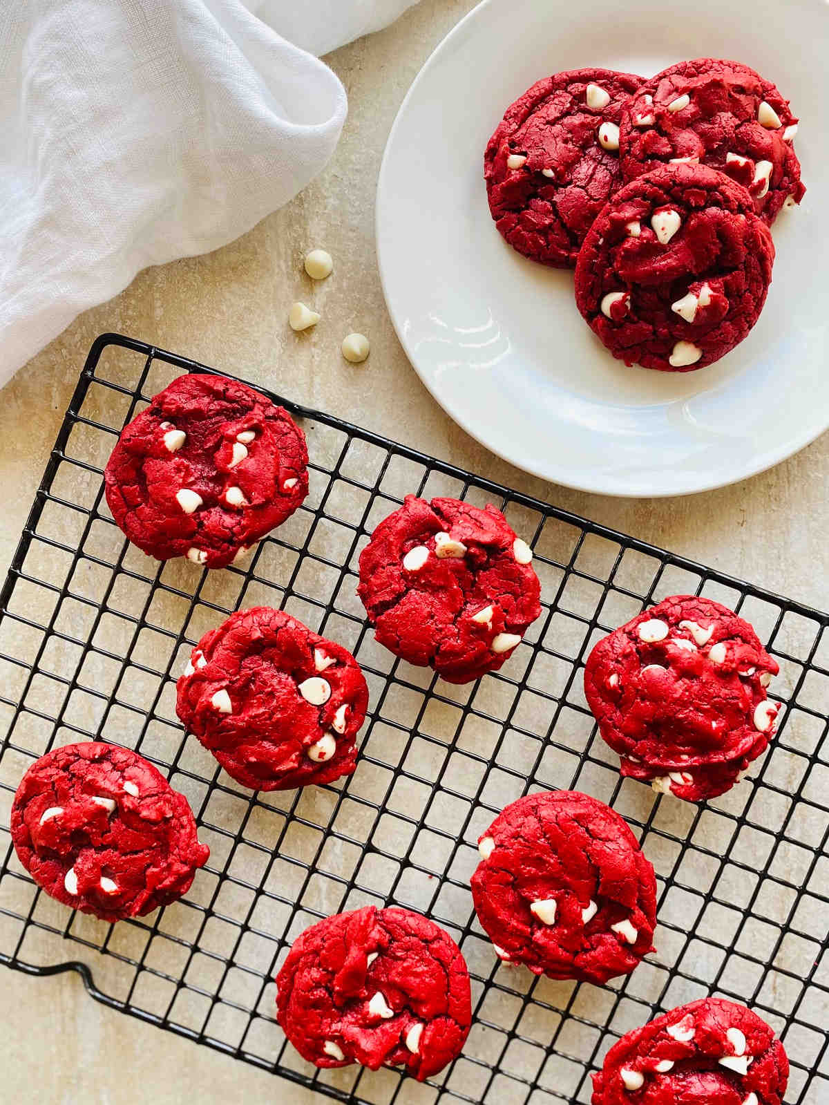 duncan hines red velvet cookies on a plate and cooling rack