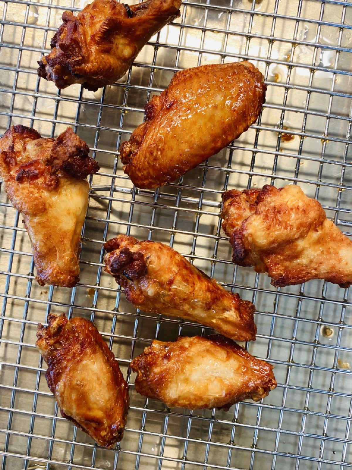 brined chicken wings smoked on a cooling rack