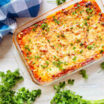 palmini lasagna recipe in baking dish next to parsley