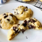chocolate chip cookies without brown sugar and one cut in half oozing chocolate