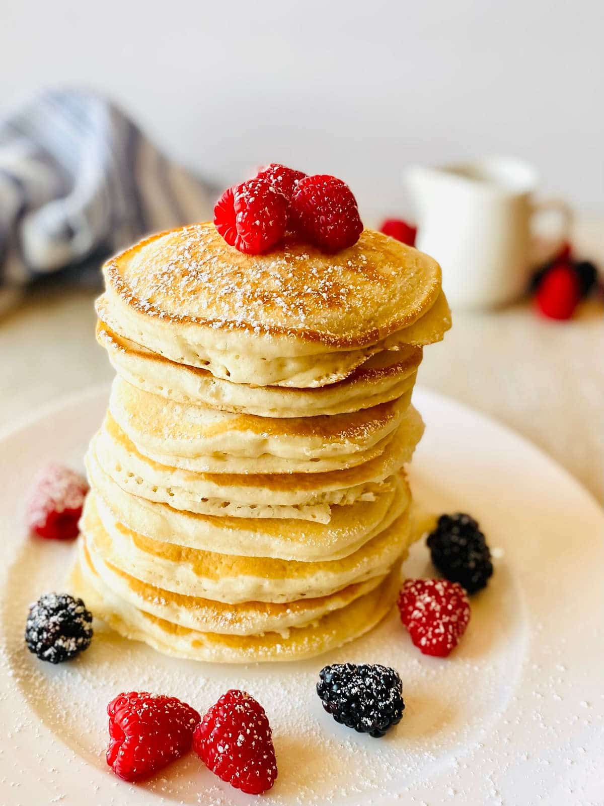 krusteaz sweet cream pancake mix pancakes on a plate with fresh berries