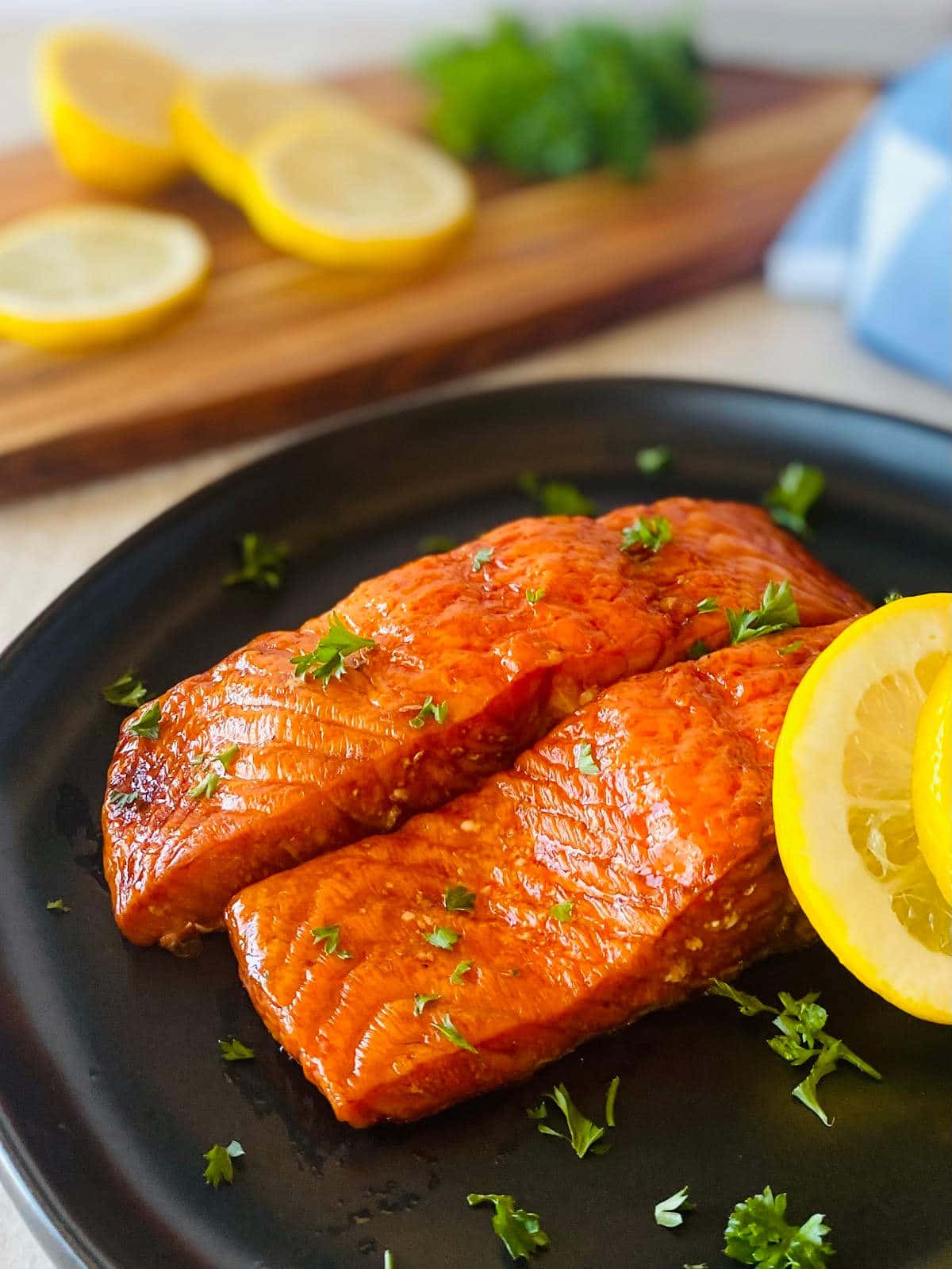 traeger salmon recipe on a plate with lemon.