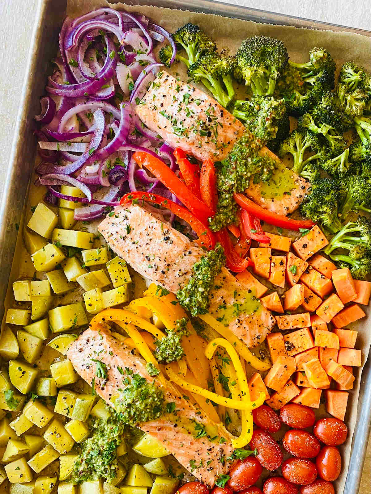 sheet pan salmon and a variety of rainbow colored veggies.