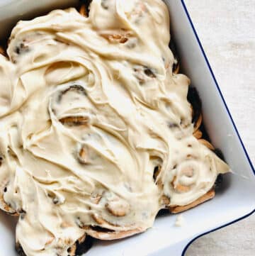 cinnamon rolls topped with cream cheese icing.