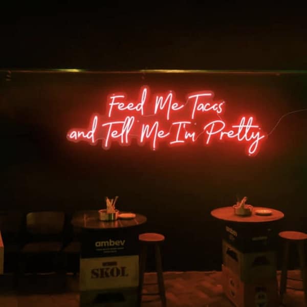 candy neon sign that says feed me tacos and tell me i'm pretty.